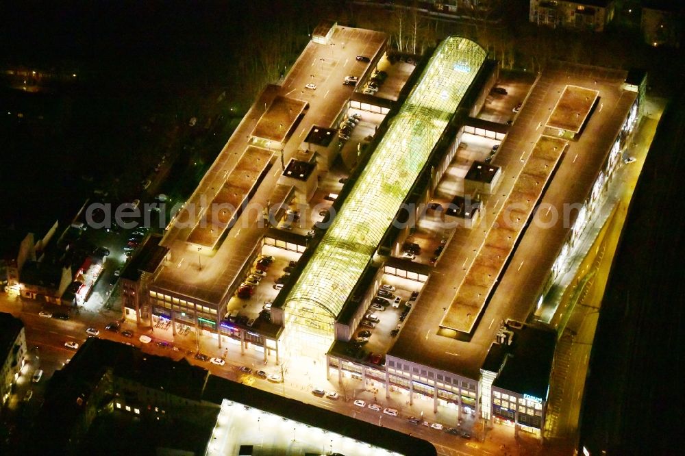 Aerial photograph at night Berlin - Night lighting building of the shopping center Forum Koepenick in the district Koepenick in Berlin, Germany