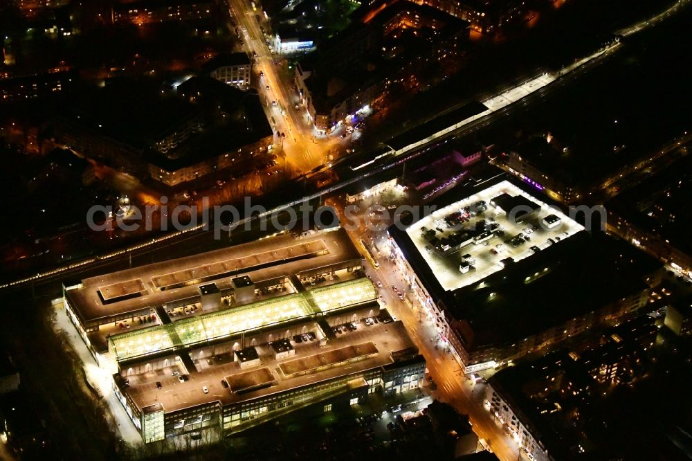 Aerial photograph at night Berlin - Night lighting building of the shopping center Forum Koepenick in the district Koepenick in Berlin, Germany