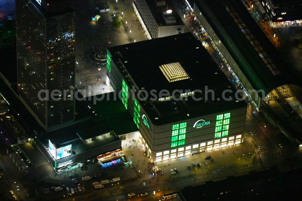 Aerial image at night Berlin - Night lighting Building of the shopping center Galeria Kaufhof in the district Mitte in Berlin, Germany