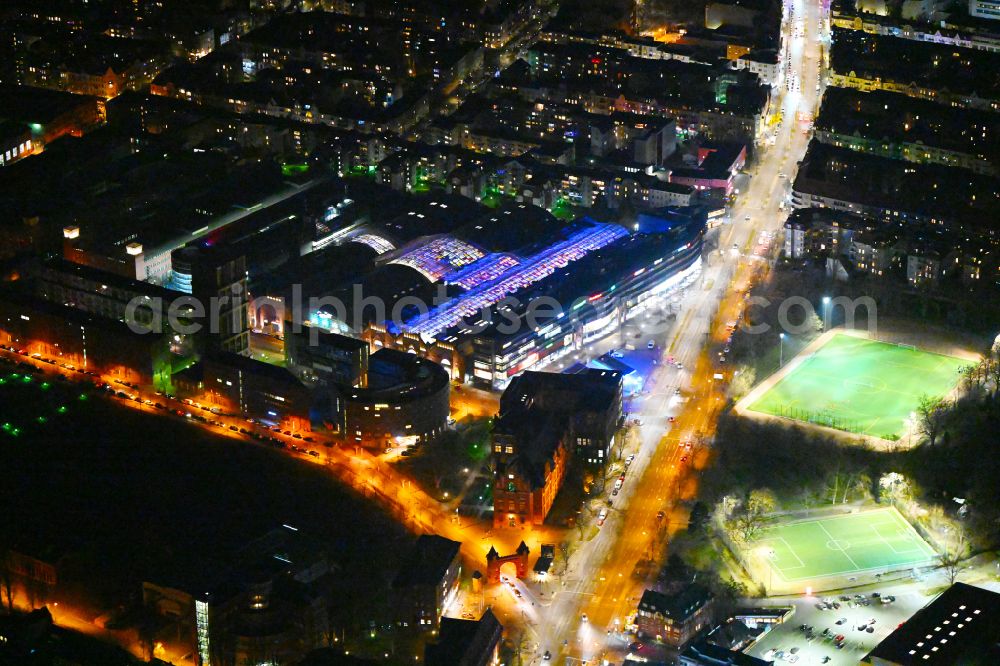 Aerial image at night Berlin - Night lighting Building of the shopping center Hallen on Borsigturm on street Am Borsigturm in the district Tegel in Berlin, Germany