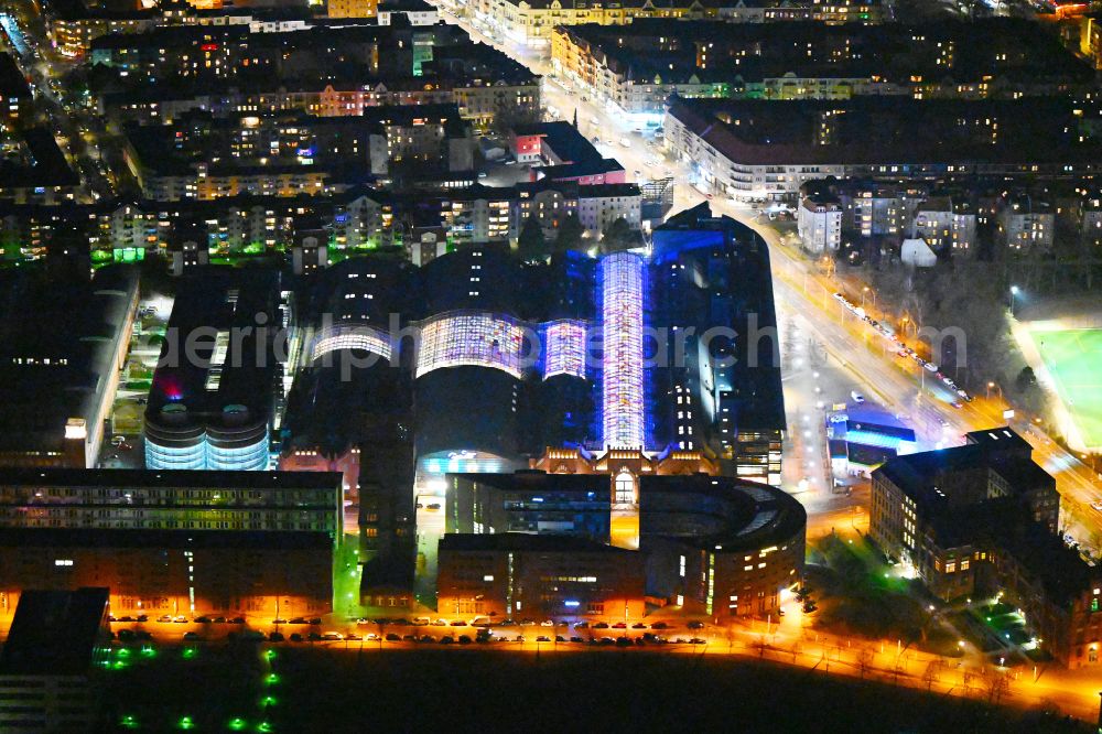 Aerial image at night Berlin - Night lighting Building of the shopping center Hallen on Borsigturm on street Am Borsigturm in the district Tegel in Berlin, Germany