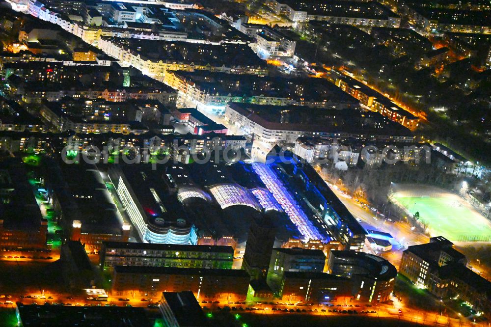 Berlin at night from above - Night lighting Building of the shopping center Hallen on Borsigturm on street Am Borsigturm in the district Tegel in Berlin, Germany