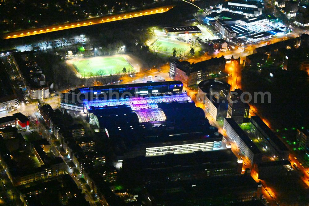 Aerial photograph at night Berlin - Night lighting Building of the shopping center Hallen on Borsigturm on street Am Borsigturm in the district Tegel in Berlin, Germany