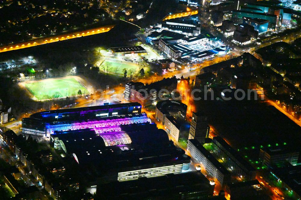 Berlin at night from above - Night lighting Building of the shopping center Hallen on Borsigturm on street Am Borsigturm in the district Tegel in Berlin, Germany