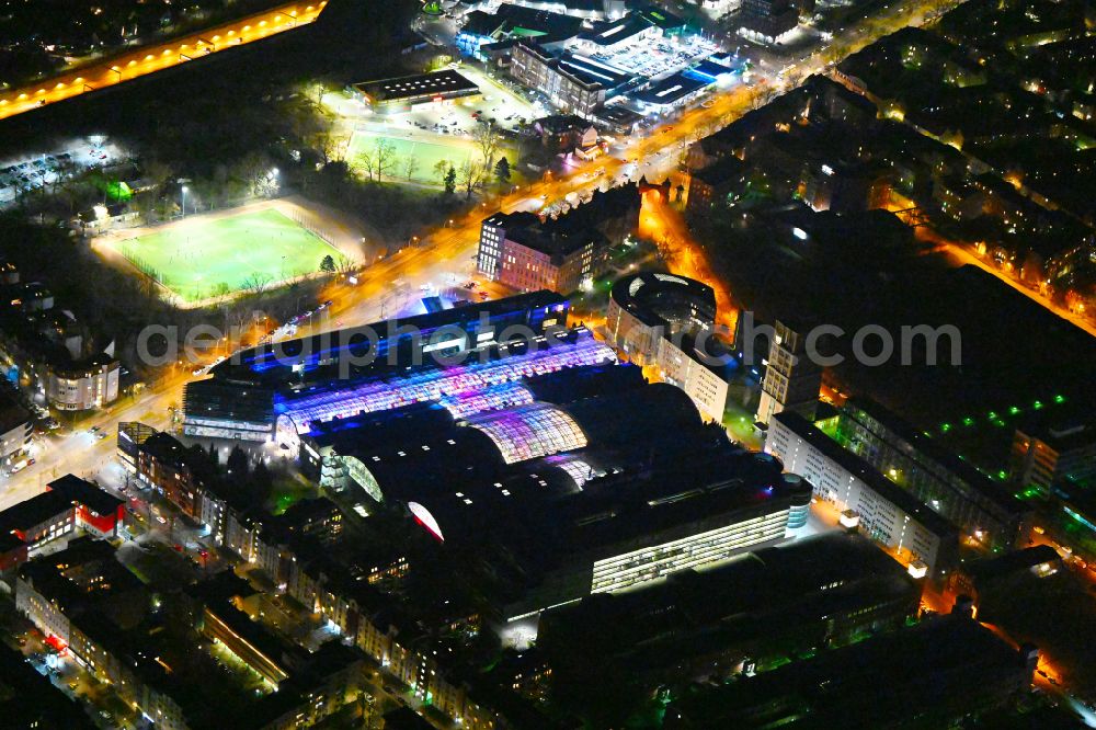 Aerial photograph at night Berlin - Night lighting Building of the shopping center Hallen on Borsigturm on street Am Borsigturm in the district Tegel in Berlin, Germany