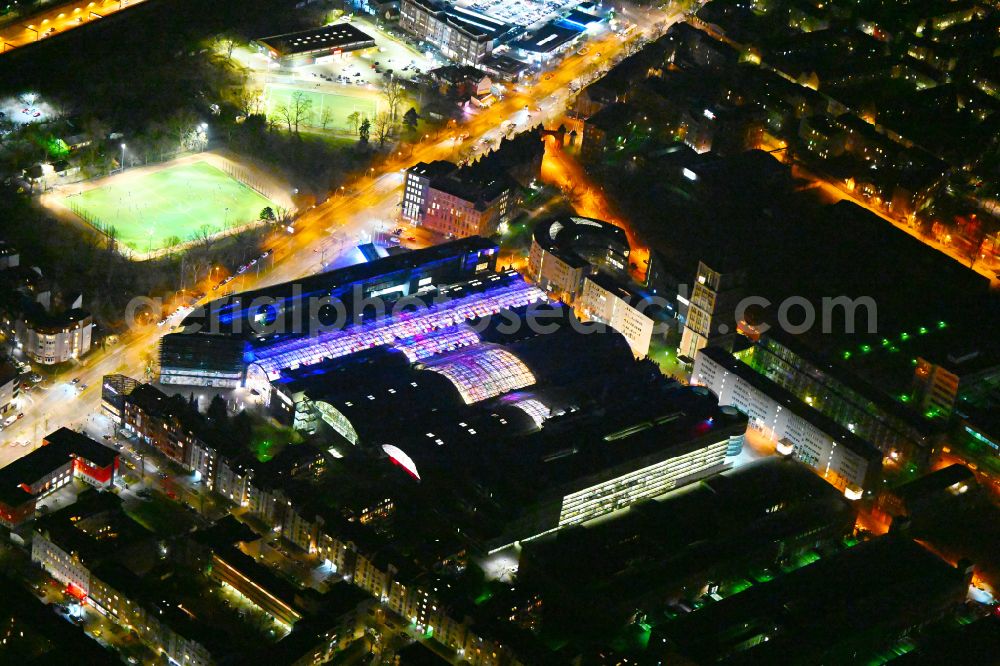 Aerial image at night Berlin - Night lighting Building of the shopping center Hallen on Borsigturm on street Am Borsigturm in the district Tegel in Berlin, Germany