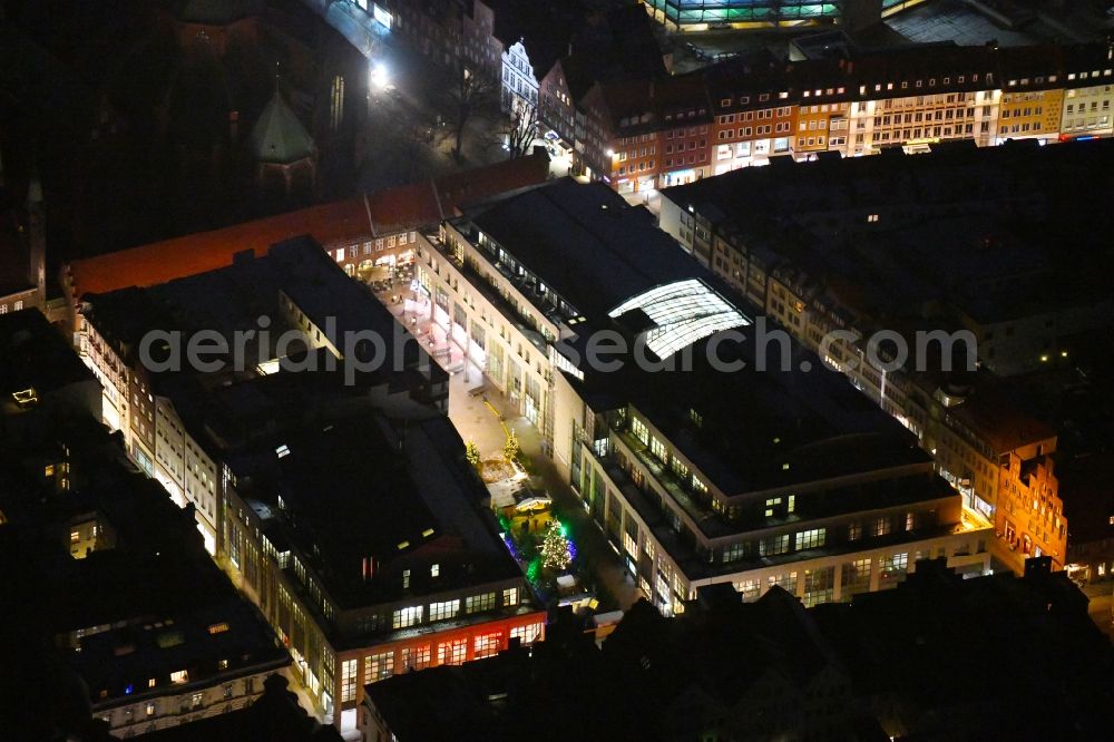 Lübeck at night from above - Night lighting building of the shopping center KARSTADT - Kaufhaus on Koenigsstrasse in the district Innenstadt in Luebeck in the state Schleswig-Holstein, Germany