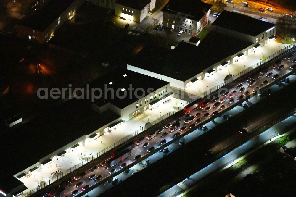 Ludwigsfelde at night from above - Night lighting Building of the shopping center Ludwig Arkaden of McCafferty Asset Management GmbH in Ludwigsfelde in the state Brandenburg, Germany