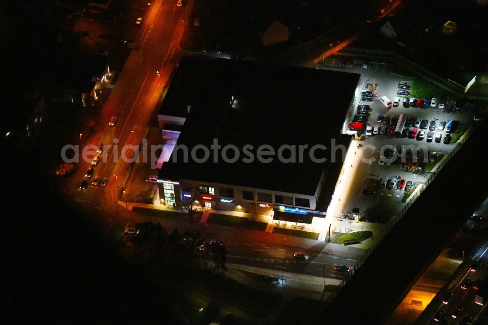 Ludwigsfelde at night from above - Night lighting Building of the shopping center Ludwig Arkaden of McCafferty Asset Management GmbH in Ludwigsfelde in the state Brandenburg, Germany