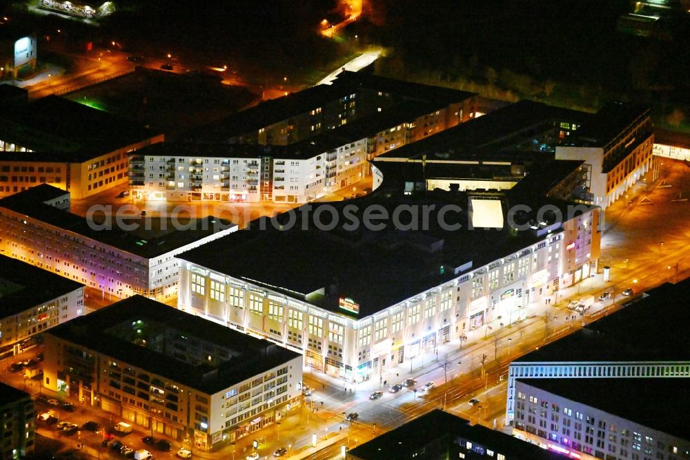 Aerial image at night Berlin - Night lighting building of the shopping center Marktplatz Center - Berlin-Hellersdorf on Stendaler Strasse in the district Hellersdorf in Berlin, Germany