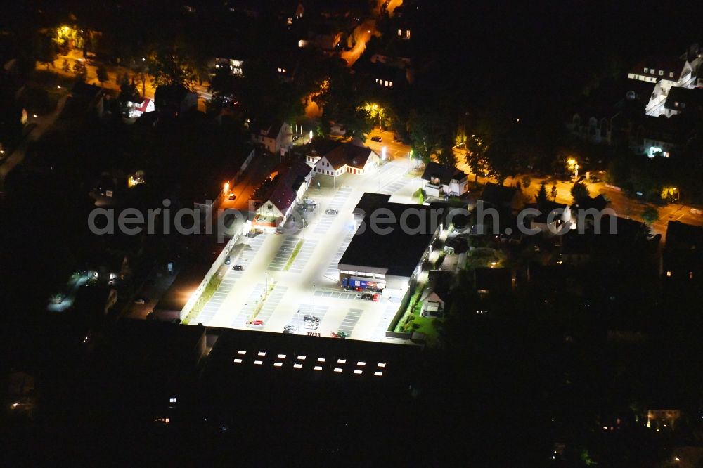 Aerial image at night Potsdam - Night lighting building of the shopping center on Potsdamer Strasse in the district Bornstedt in Potsdam in the state Brandenburg, Germany