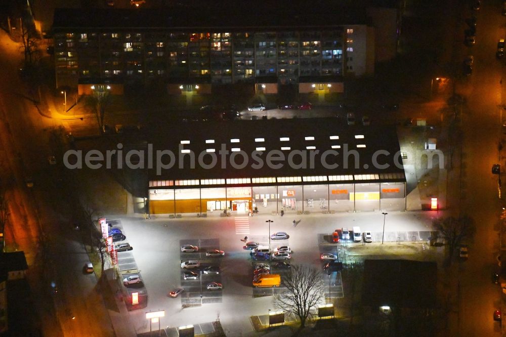 Aerial image at night Fürstenwalde/Spree - Night lighting Building of the shopping center REWE on Trebuser Strasse in Fuerstenwalde/Spree in the state Brandenburg, Germany