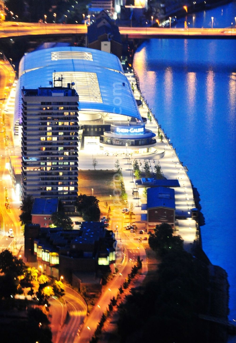 Ludwigshafen am Rhein at night from the bird perspective: Night lighting building of the shopping center Rhein-Galerie in Ludwigshafen am Rhein in the state Rhineland-Palatinate, Germany