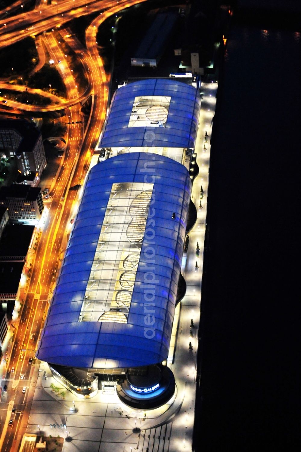 Ludwigshafen am Rhein at night from the bird perspective: Night lighting building of the shopping center Rhein-Galerie in Ludwigshafen am Rhein in the state Rhineland-Palatinate, Germany