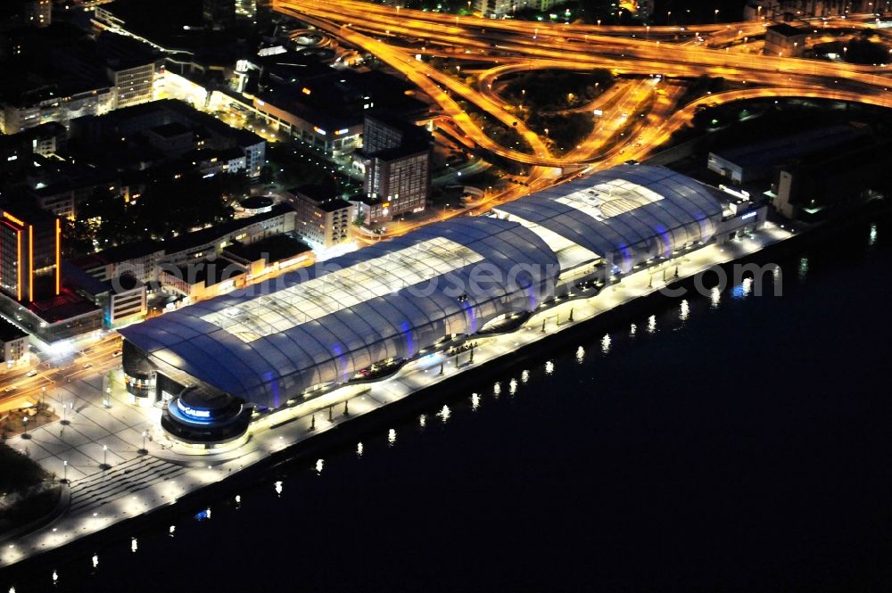 Ludwigshafen am Rhein at night from the bird perspective: Night lighting building of the shopping center Rhein-Galerie in Ludwigshafen am Rhein in the state Rhineland-Palatinate, Germany