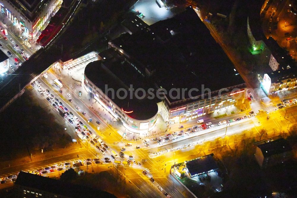 Aerial image at night Berlin - Night lighting Building of the shopping center Ring-Center Berlin on Frankfurter Allee in the district Friedrichshain in Berlin, Germany