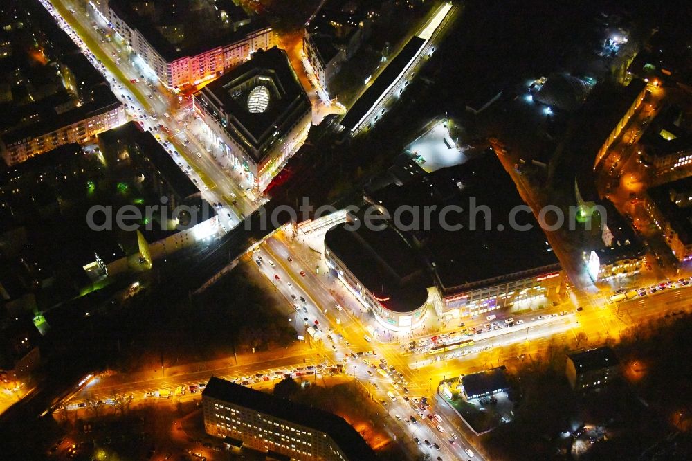 Berlin at night from the bird perspective: Night lighting Building of the shopping center Ring-Center Berlin on Frankfurter Allee in the district Friedrichshain in Berlin, Germany