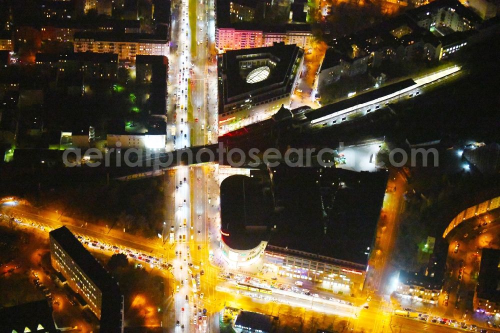 Aerial image at night Berlin - Night lighting Building of the shopping center Ring-Center Berlin on Frankfurter Allee in the district Friedrichshain in Berlin, Germany