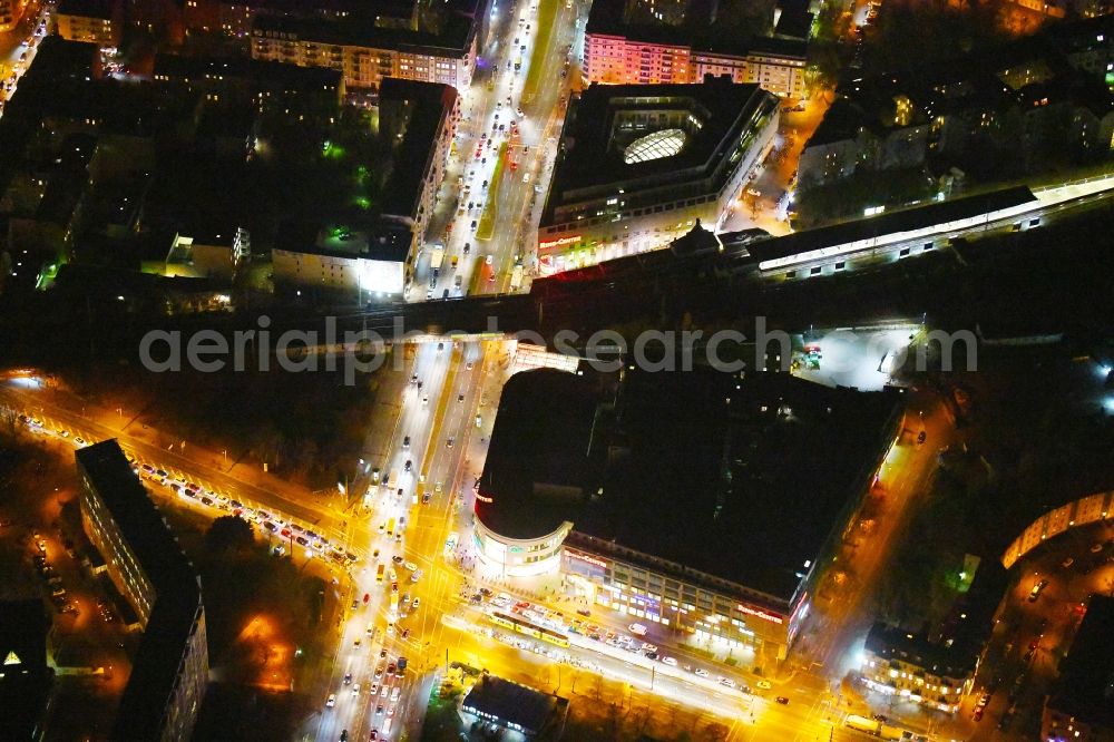 Berlin at night from the bird perspective: Night lighting Building of the shopping center Ring-Center Berlin on Frankfurter Allee in the district Friedrichshain in Berlin, Germany