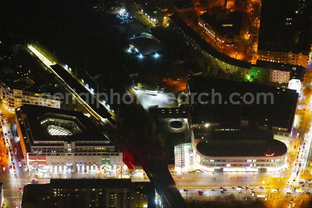 Aerial image at night Berlin - Night lighting Building of the shopping center Ring-Center Berlin on Frankfurter Allee in the district Friedrichshain in Berlin, Germany