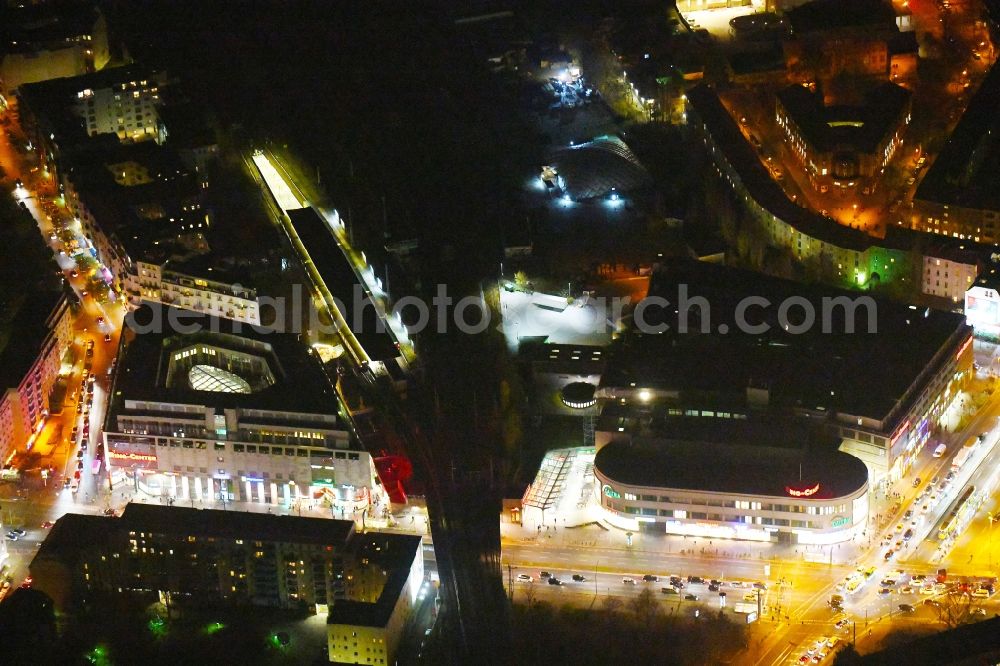 Berlin at night from above - Night lighting Building of the shopping center Ring-Center Berlin on Frankfurter Allee in the district Friedrichshain in Berlin, Germany