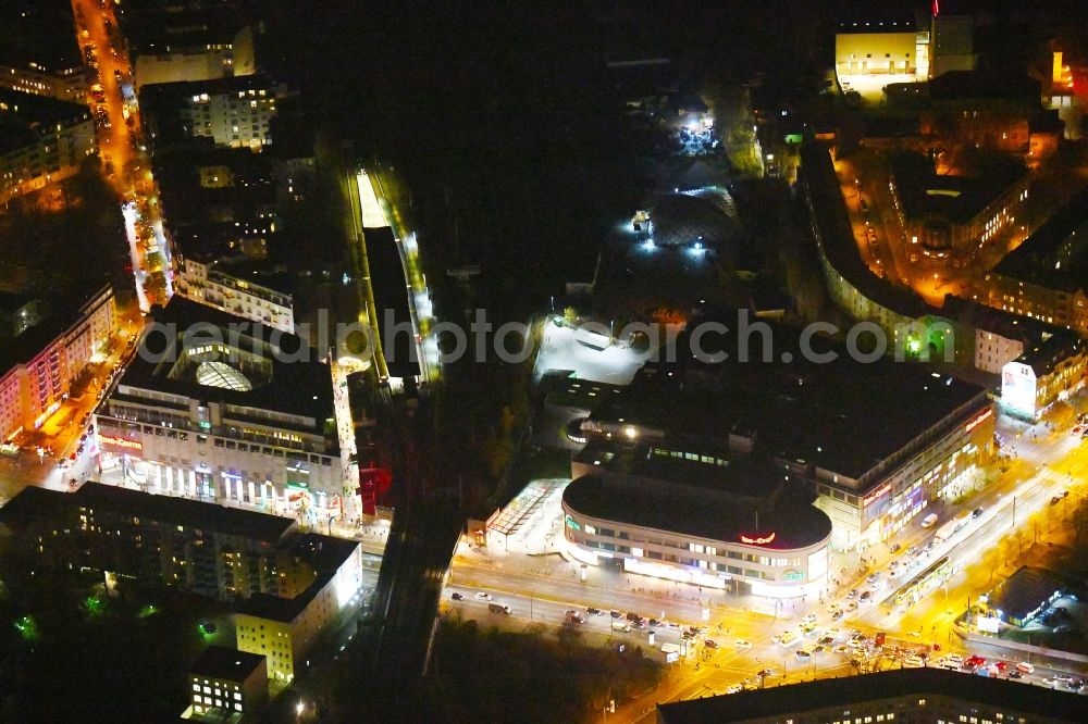 Berlin at night from the bird perspective: Night lighting Building of the shopping center Ring-Center Berlin on Frankfurter Allee in the district Friedrichshain in Berlin, Germany