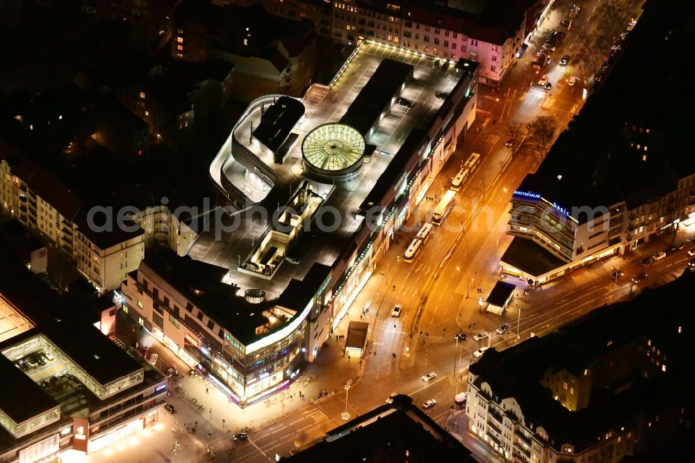 Berlin at night from the bird perspective: Night lighting building of the shopping center Schloss-Strassen-Center Berlin on place Walther-Schreiber-Platz in the district Friedenau in Berlin, Germany