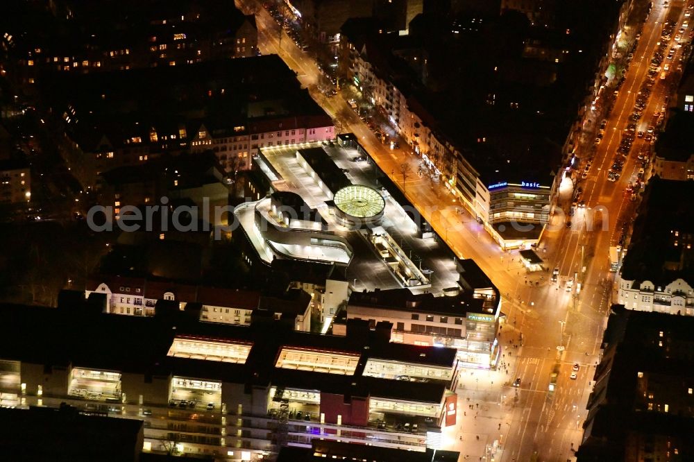 Aerial image at night Berlin - Night lighting building of the shopping center Schloss-Strassen-Center Berlin on place Walther-Schreiber-Platz in the district Friedenau in Berlin, Germany