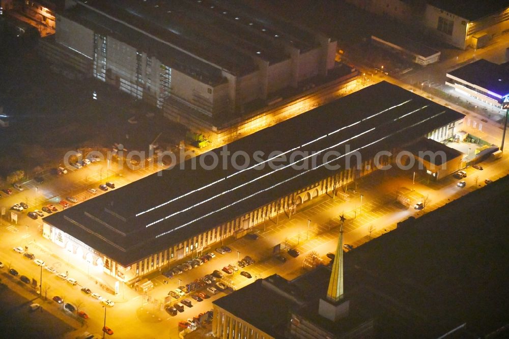 Aerial image at night Leipzig - Night lighting Building of the shopping center Str. of 18. Oktober corner Szendreistrasse in the district Zentrum-Suedost in Leipzig in the state Saxony, Germany