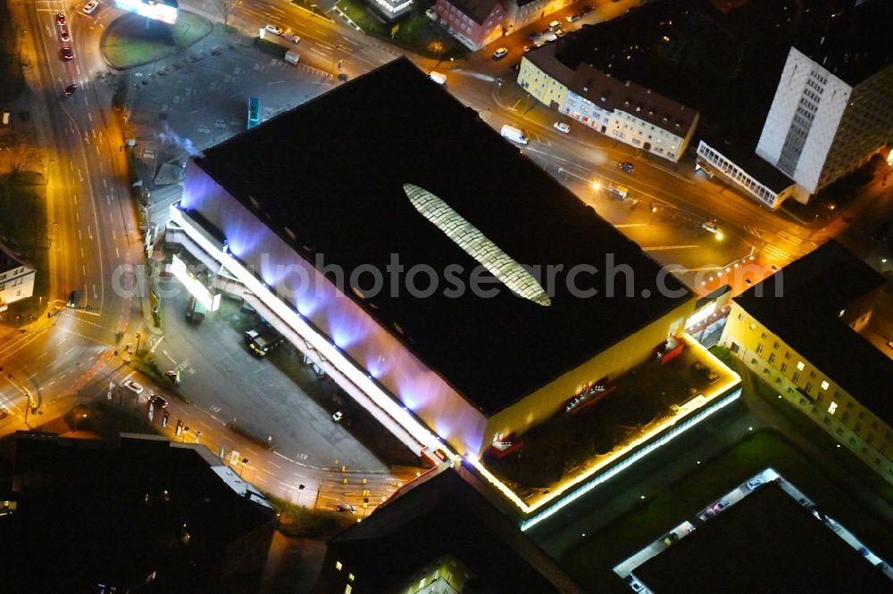 Aerial image at night Weimar - Night lighting Building of the shopping center Weimar Atrium on Friedensstrasse in Weimar in the state Thuringia, Germany