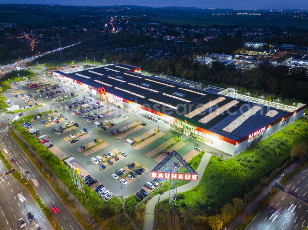 Aerial image at night Dresden - Night lighting building complex of the shopping center Kaufpark Dresden on Dohnaer Strasse in the Lockwitz district of Dresden in the state of Saxony, Germany