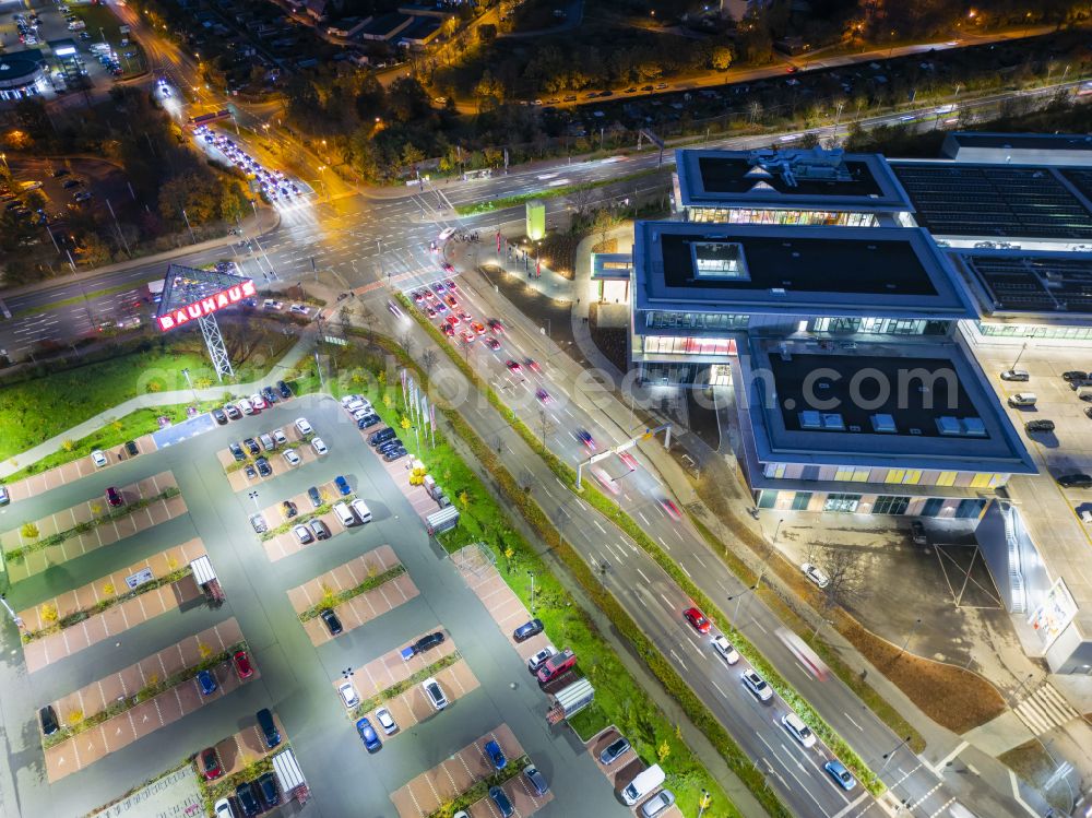 Aerial photograph at night Dresden - Night lighting building complex of the shopping center Kaufpark Dresden on Dohnaer Strasse in the Lockwitz district of Dresden in the state of Saxony, Germany