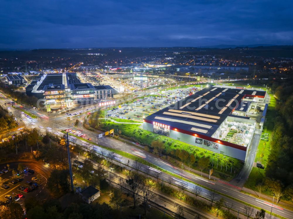 Aerial image at night Dresden - Night lighting building complex of the shopping center Kaufpark Dresden on Dohnaer Strasse in the Lockwitz district of Dresden in the state of Saxony, Germany