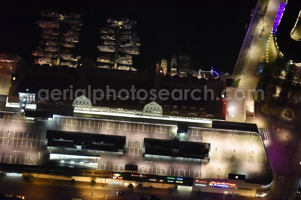 Aerial image at night Berlin - Night image with a view of the shopping mall Tempelhofer Hafen and Ullsteinhaus on Tempelhofer Damm in the district of Tempelhof in Berlin