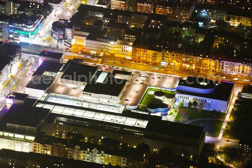 Aerial image at night Berlin - Night lighting at the shopping center Boulevard Berlin at Schlossstrasse, Schildhornstrasse, Lepsiusstrasse, Markelstrasse in Berlin-Steglitz. The building contractor was BAM Germany