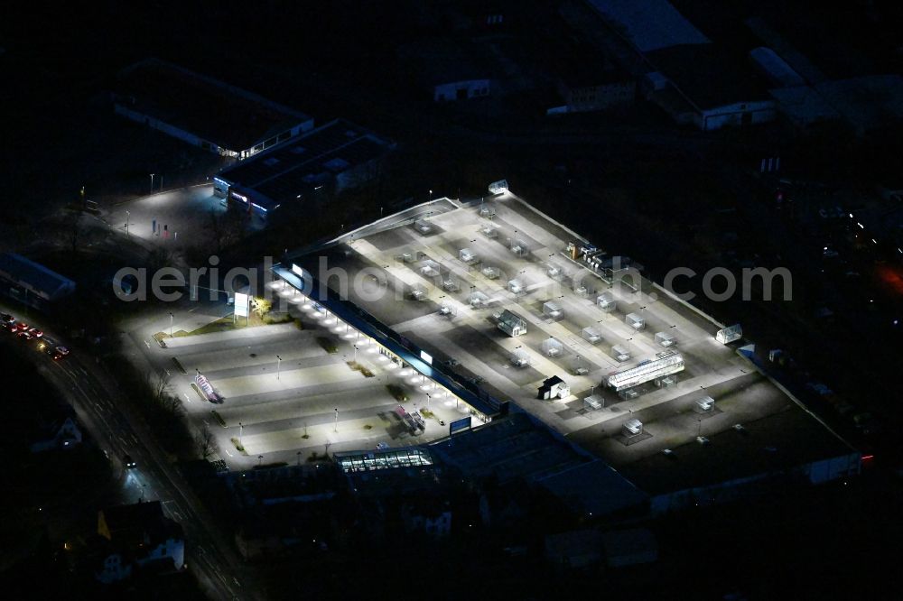 Meiningen at night from above - Night lighting building of the shopping center on Defertshaeuser Weg in Meiningen in the state Thuringia, Germany