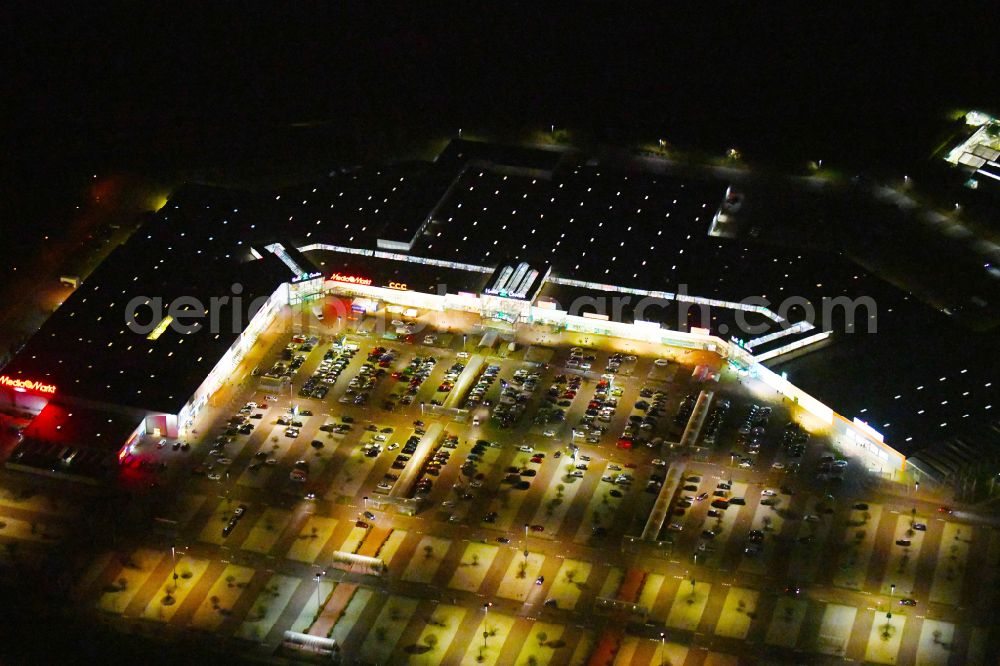 Landsberg at night from above - Night lighting building of the shopping center Halle Center on street Saarbruecker Strasse in the district Peissen in Landsberg in the state Saxony-Anhalt, Germany