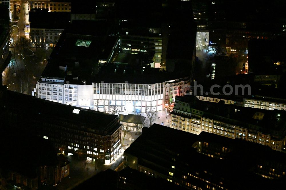 Hamburg at night from the bird perspective: Night lighting building of the shopping center in the Moenckebergstrasse in the district Altstadt in Hamburg, Germany