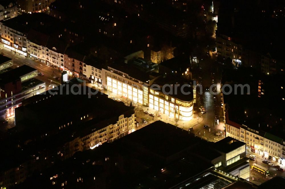 Berlin at night from above - Night lighting building of the shopping center Peek & Cloppenburg on Schlossstrasse corner Feuerbachstrasse in the district Steglitz in Berlin, Germany