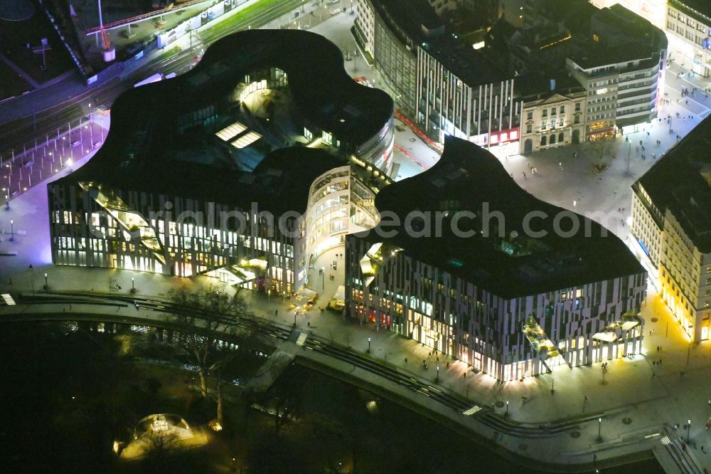 Düsseldorf at night from the bird perspective: Night lighting construction of retail and office property Koe-Bogen in Dusseldorf in North Rhine-Westphalia