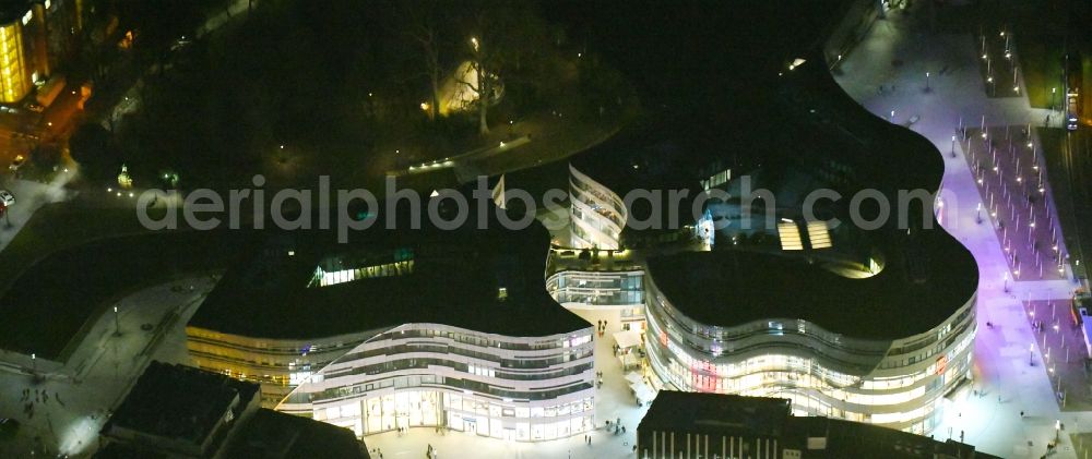 Düsseldorf at night from the bird perspective: Night lighting construction of retail and office property Koe-Bogen in Dusseldorf in North Rhine-Westphalia