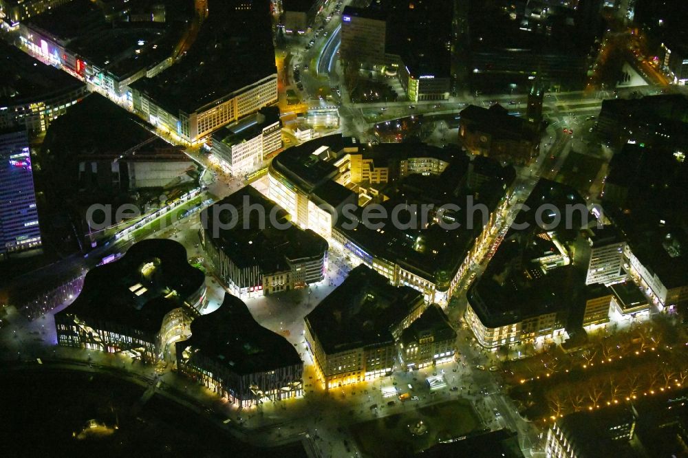 Düsseldorf at night from the bird perspective: Night lighting construction of retail and office property Koe-Bogen in Dusseldorf in North Rhine-Westphalia