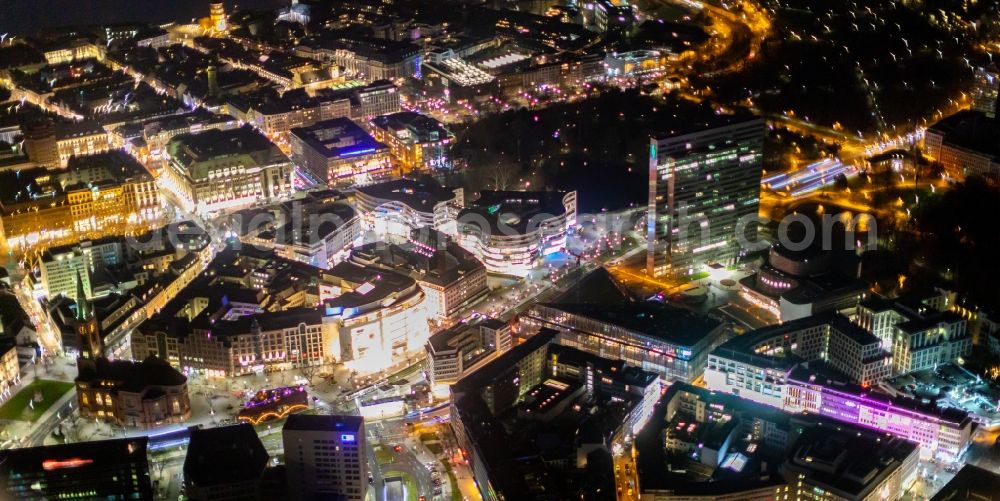 Düsseldorf at night from the bird perspective: Night lighting construction of retail and office property Koe-Bogen in Dusseldorf in North Rhine-Westphalia