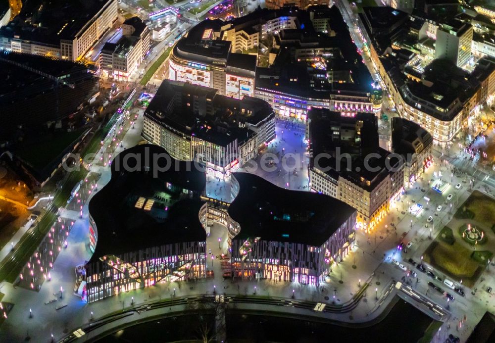 Düsseldorf at night from the bird perspective: Night lighting construction of retail and office property Koe-Bogen in Dusseldorf in North Rhine-Westphalia