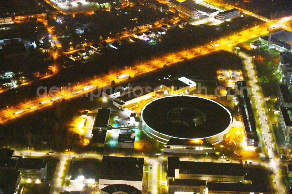 Berlin at night from the bird perspective: Night lighting The electron storage ring BESSY - the third generation synchrotron radiation source in Berlin - Adlershof