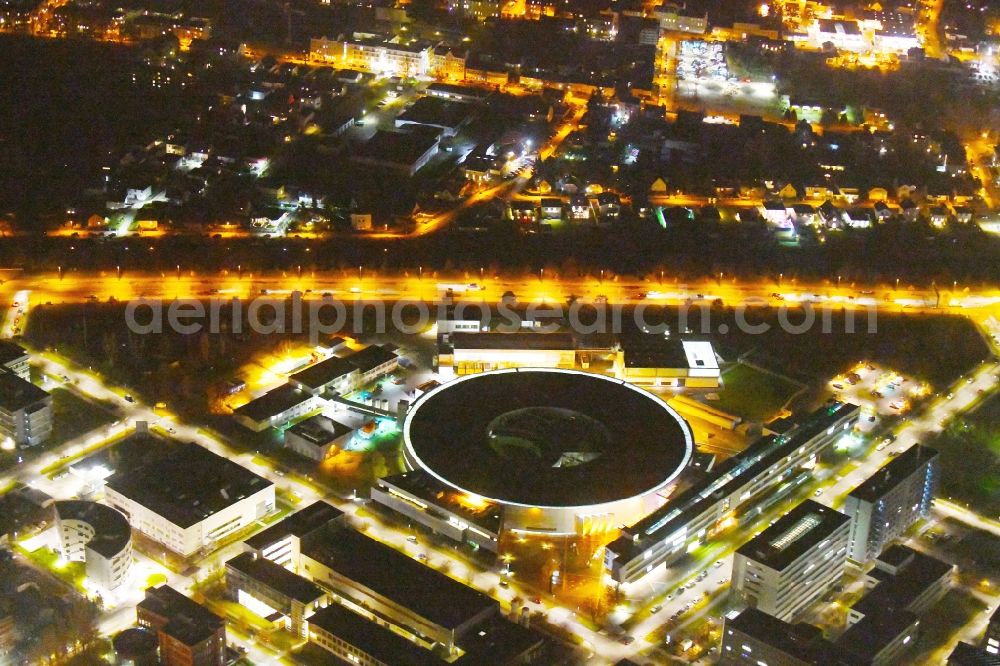 Berlin at night from above - Night lighting The electron storage ring BESSY - the third generation synchrotron radiation source in Berlin - Adlershof