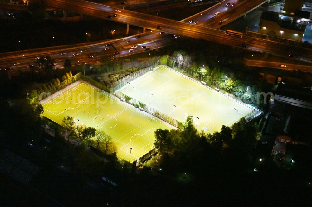 Aerial photograph at night Berlin - Night lighting ensemble of sports grounds of BSV 1892 on Forckenbeckstrasse in the district Schmargendorf in Berlin, Germany