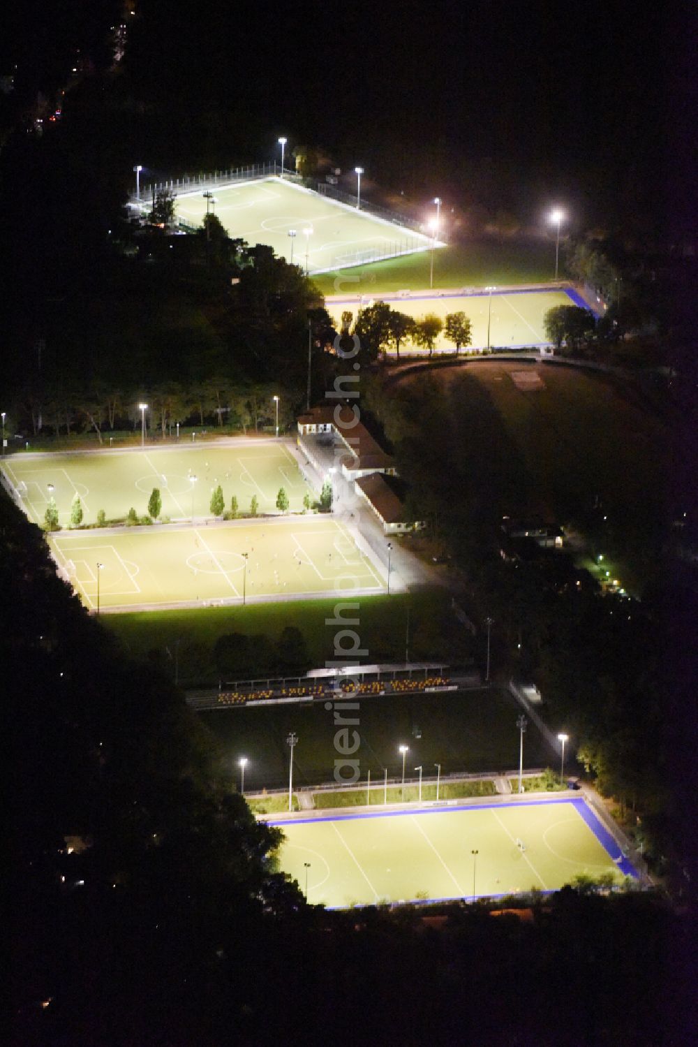 Aerial photograph at night Berlin - Night lighting Ensemble of sports grounds Ernst-Reuter-Sportfeld Onkel-Tom-Strasse in the district Zehlendorf in Berlin, Germany