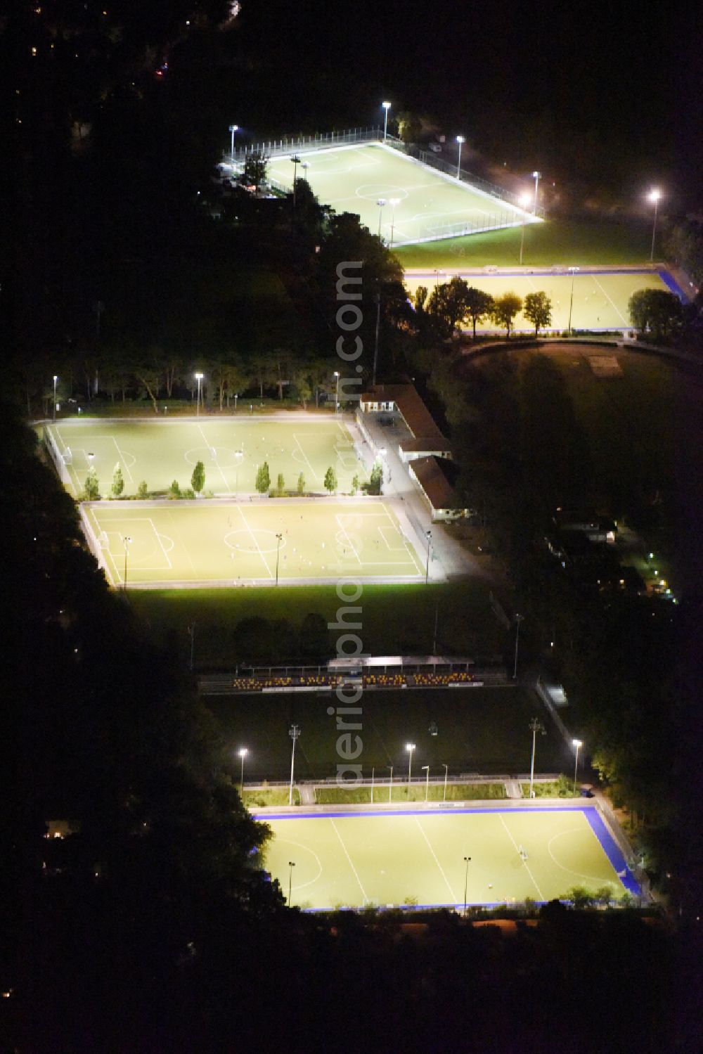 Aerial image at night Berlin - Night lighting Ensemble of sports grounds Ernst-Reuter-Sportfeld Onkel-Tom-Strasse in the district Zehlendorf in Berlin, Germany