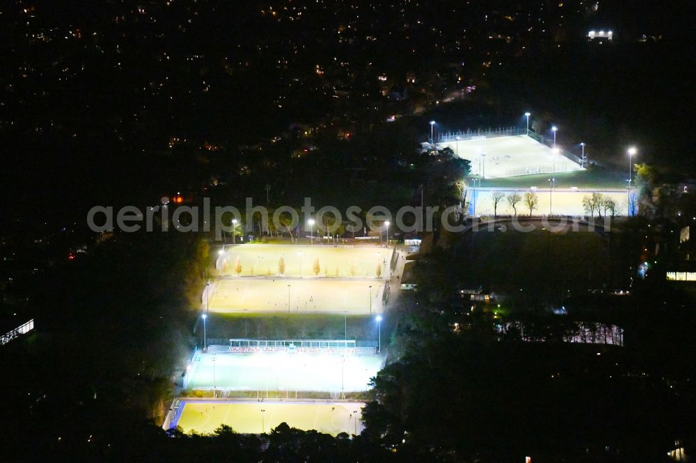 Berlin at night from above - Night lighting Ensemble of sports grounds Ernst-Reuter-Sportfeld Onkel-Tom-Strasse in the district Zehlendorf in Berlin, Germany